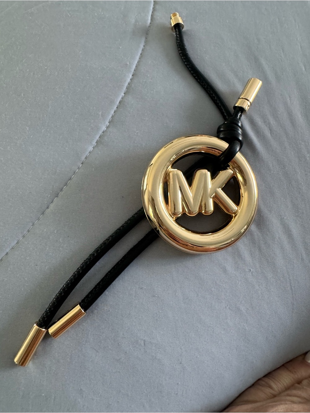 Michael Kors Gold MK Logo bag charm Pendant on Black leather Cord